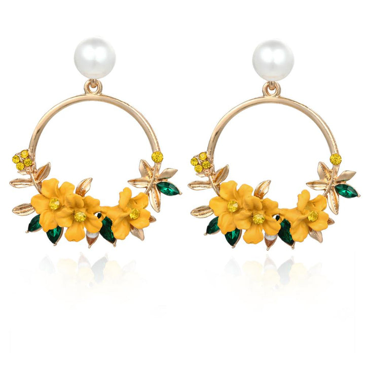Elegant gold earrings adorned with flowers and pearls