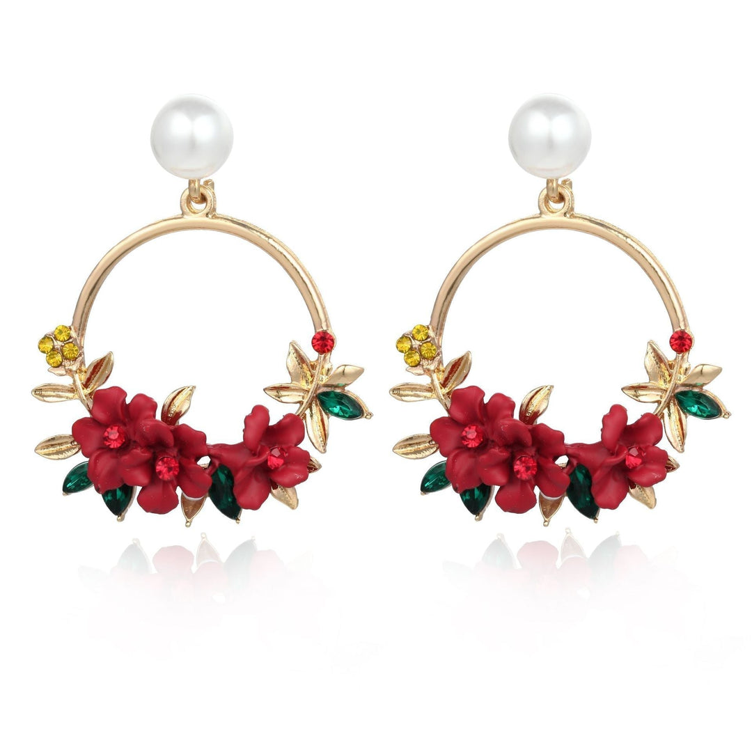 Elegant gold earrings adorned with flowers and pearls