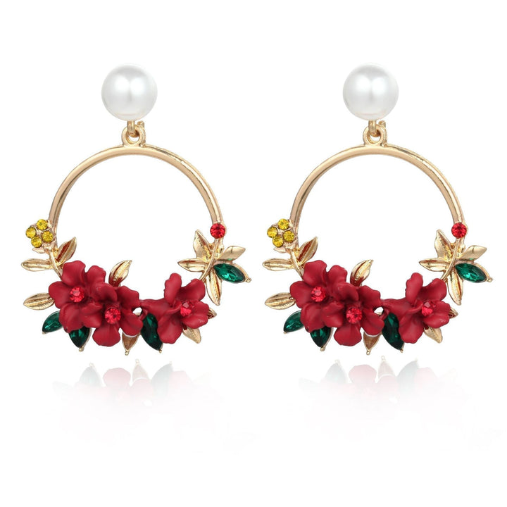 Elegant gold earrings adorned with flowers and pearls